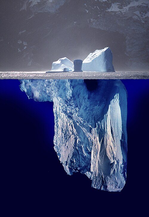 An iceberg, with most of its mass below the waterline